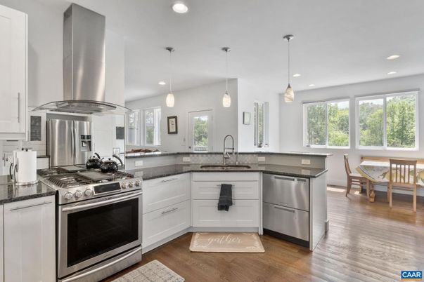 Dining room, Interior, Kitchen, Pendant Lights, Recessed Lighting, Stainless Steel Appliances, Wood Texture Flooring