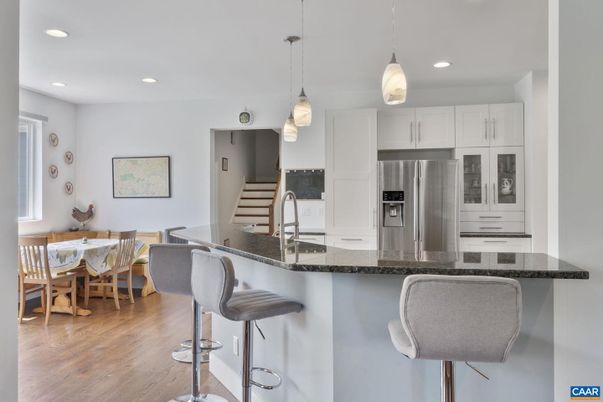 Dining room, Interior, Kitchen, Pendant Lights, Recessed Lighting, Stainless Steel Appliances, Wood Texture Flooring