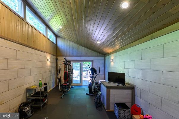 Fitness Equipment, Interior, Recessed Lighting, Stone Walls, Wooden Ceilings
