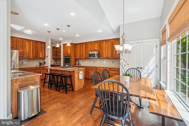 Chandelier, Dining room, Interior, Kitchen, Pendant Lights, Recessed Lighting, Stainless Steel Appliances, Wood Texture Flooring