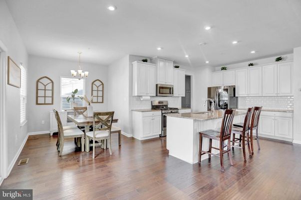Chandelier, Dining room, Interior, Kitchen, Recessed Lighting, Stainless Steel Appliances, Wood Texture Flooring