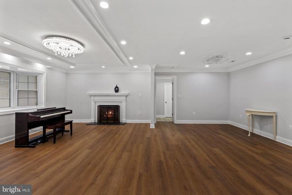Chandelier, Fireplace, Interior, Piano, Recessed Lighting, Wood Texture Flooring