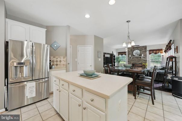 Dining room, Fireplace, Interior, Kitchen, Pendant Lights, Recessed Lighting, Stainless Steel Appliances, Stone Walls