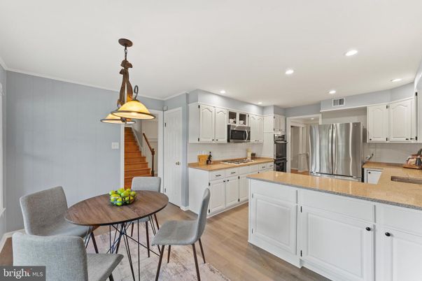 Dining room, Interior, Kitchen, Pendant Lights, Recessed Lighting, Stainless Steel Appliances, Wood Texture Flooring