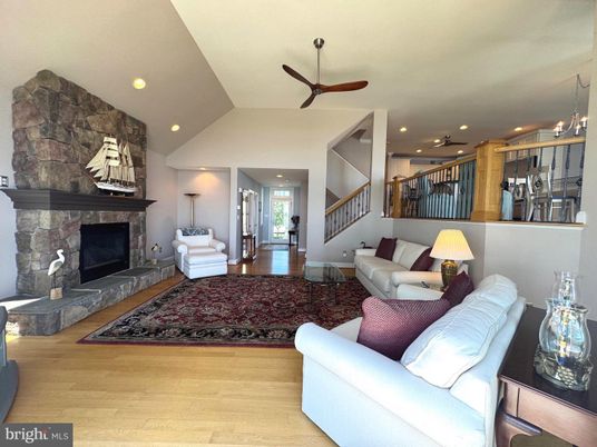 Fireplace, Interior, Living room, Pendant Lights, Recessed Lighting, Stone Walls, Wood Texture Flooring