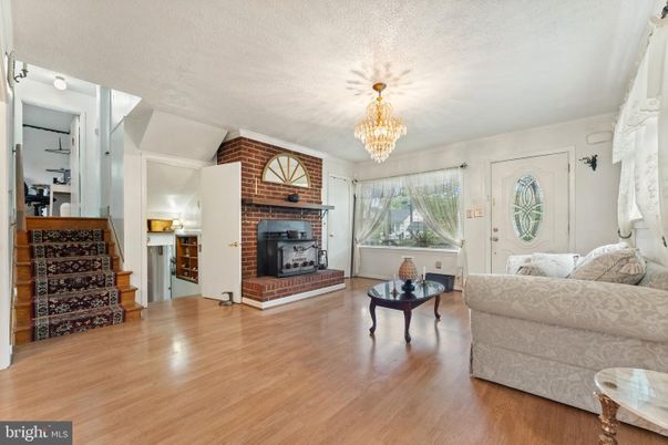 Chandelier, Fireplace, Interior, Living room, Stone Walls, Wood Texture Flooring