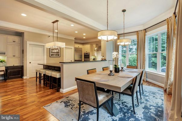 Chandelier, Dining room, Interior, Kitchen, Pendant Lights, Recessed Lighting, Stainless Steel Appliances, Wood Texture Flooring