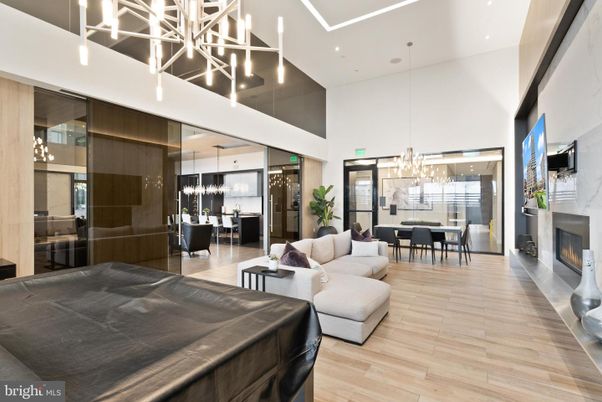 Chandelier, Dining room, Fireplace, Interior, Living room, Pendant Lights, Recessed Lighting, Wood Texture Flooring