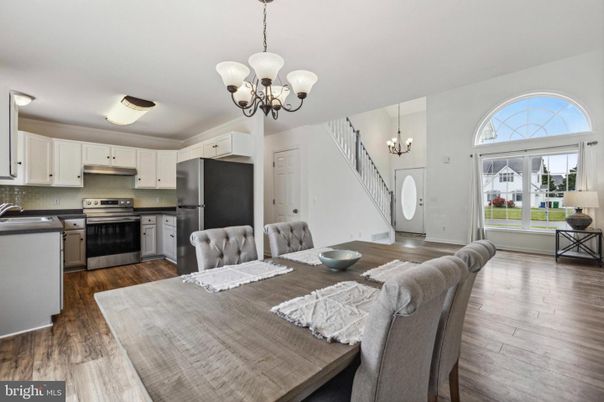 Chandelier, Dining room, Interior, Kitchen, Pendant Lights, Stainless Steel Appliances, Wood Texture Flooring