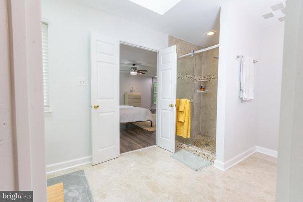 Bathroom, Bedroom, Glass Shower, Interior, Recessed Lighting, Wood Texture Flooring