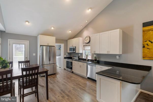 Dining room, Interior, Kitchen, Recessed Lighting, Stainless Steel Appliances, Wood Texture Flooring