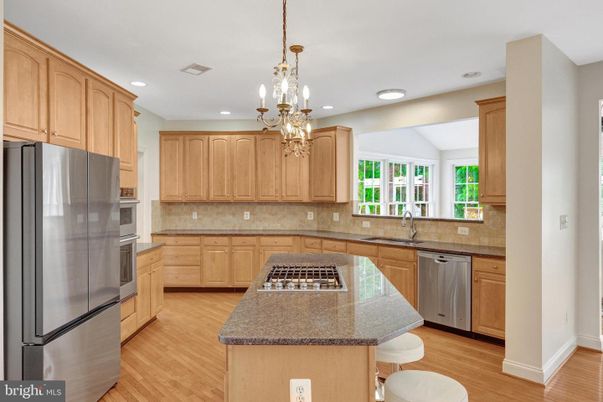Chandelier, Interior, Kitchen, Pendant Lights, Recessed Lighting, Stainless Steel Appliances, Wood Texture Flooring