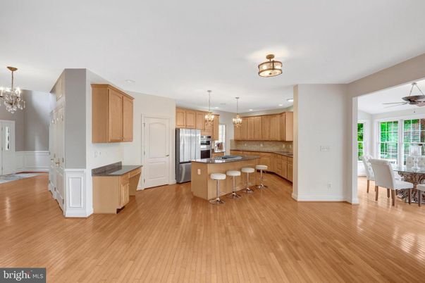 Chandelier, Dining room, Interior, Kitchen, Pendant Lights, Recessed Lighting, Stainless Steel Appliances, Wood Texture Flooring