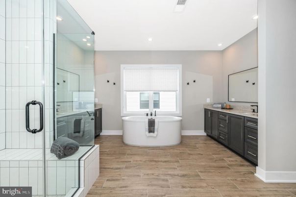 Bathroom, Dual Sink Vanities, Free Standing Baths, Glass Shower, Interior, Recessed Lighting, Wood Texture Flooring