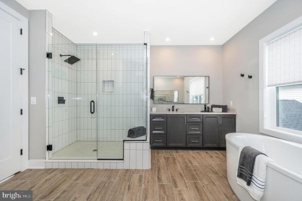 Bathroom, Dual Sink Vanities, Glass Shower, Interior, Recessed Lighting, Wood Texture Flooring