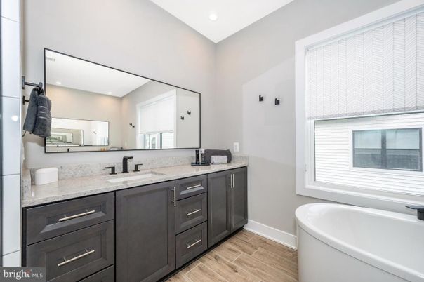 Bathroom, Dual Sink Vanities, Free Standing Baths, Interior, Recessed Lighting, Wood Texture Flooring