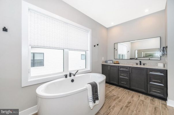 Bathroom, Dual Sink Vanities, Free Standing Baths, Interior, Recessed Lighting, Wood Texture Flooring