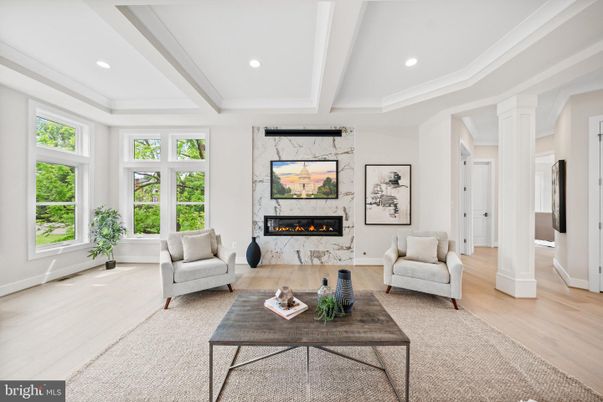 Fireplace, Interior, Living room, Marble Walls, Recessed Lighting, Wood Texture Flooring