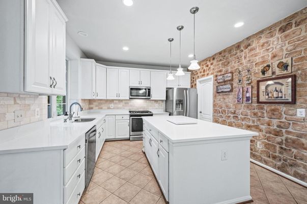 Interior, Kitchen, Pendant Lights, Recessed Lighting, Stainless Steel Appliances, Stone Walls