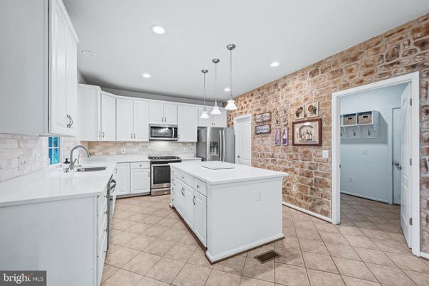 Interior, Kitchen, Pendant Lights, Recessed Lighting, Stainless Steel Appliances, Stone Walls