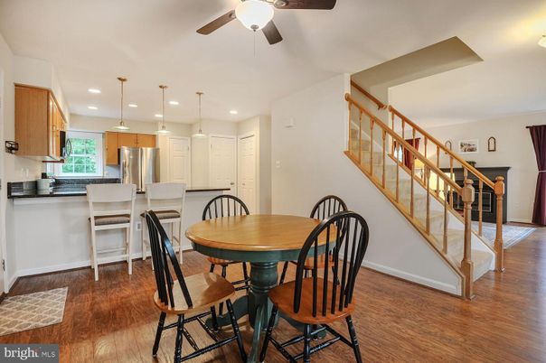 Dining room, Interior, Kitchen, Pendant Lights, Recessed Lighting, Stainless Steel Appliances, Wood Texture Flooring