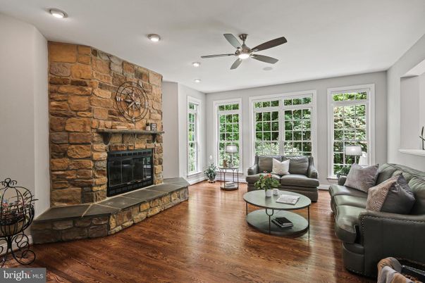Fireplace, Interior, Living room, Recessed Lighting, Stone Walls, Wood Texture Flooring
