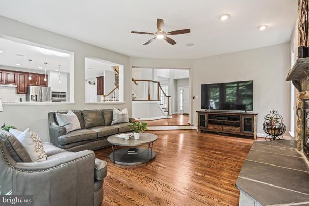 Fireplace, Interior, Kitchen, Living room, Pendant Lights, Recessed Lighting, Stainless Steel Appliances, Wood Texture Flooring