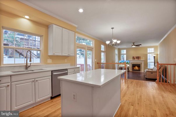 Chandelier, Dining room, Fireplace, Interior, Kitchen, Living room, Recessed Lighting, Wood Texture Flooring