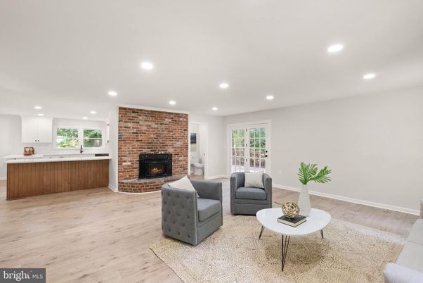 Fireplace, Interior, Living room, Recessed Lighting, Stone Walls, Wood Texture Flooring