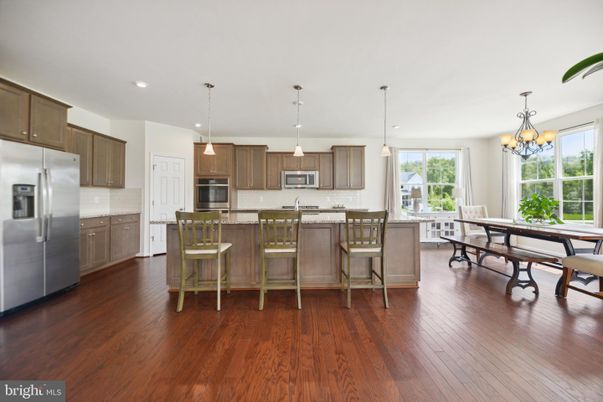 Chandelier, Dining room, Interior, Kitchen, Pendant Lights, Recessed Lighting, Stainless Steel Appliances, Wood Texture Flooring