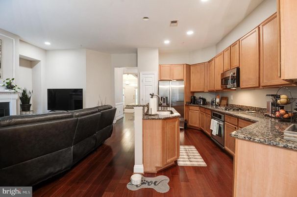 Fireplace, Interior, Kitchen, Living room, Recessed Lighting, Stainless Steel Appliances, Wood Texture Flooring