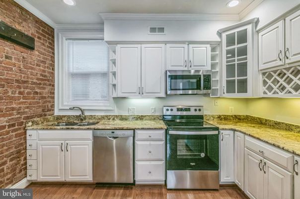 Interior, Kitchen, Recessed Lighting, Stainless Steel Appliances, Stone Walls, Wood Texture Flooring
