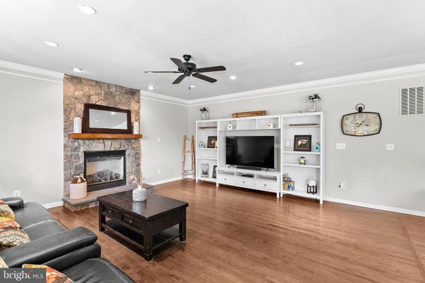 Fireplace, Interior, Living room, Recessed Lighting, Stone Walls, Wood Texture Flooring
