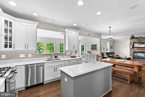 Chandelier, Dining room, Interior, Kitchen, Recessed Lighting, Stainless Steel Appliances, Wood Texture Flooring