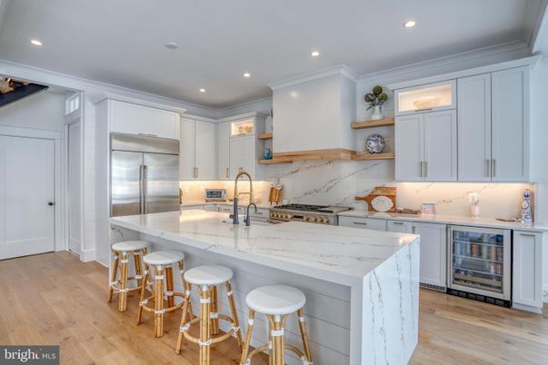 Interior, Kitchen, Marble Walls, Recessed Lighting, Stainless Steel Appliances, Wood Texture Flooring