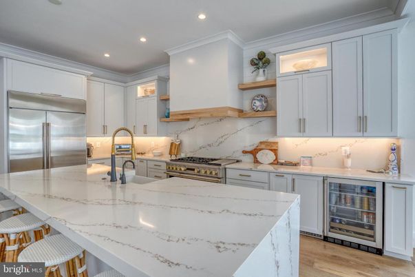 Interior, Kitchen, Marble Walls, Recessed Lighting, Stainless Steel Appliances, Wood Texture Flooring