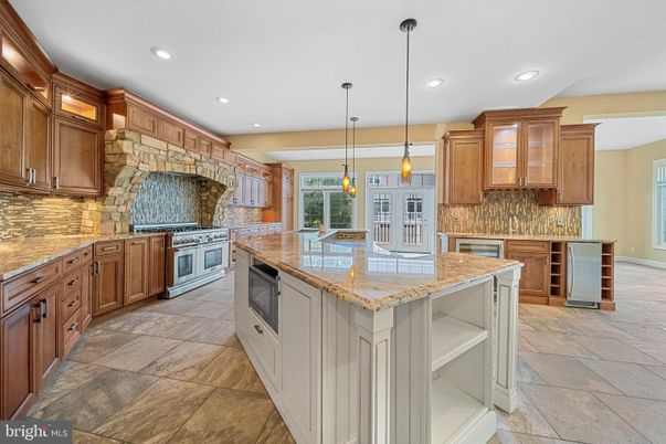 Interior, Kitchen, Pendant Lights, Recessed Lighting, Stainless Steel Appliances, Stone Walls