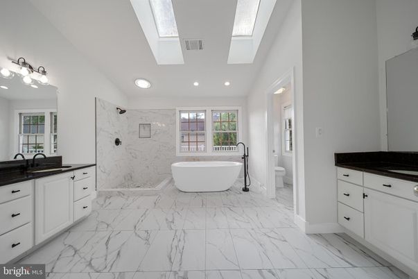 Bathroom, Dual Sink Vanities, Free Standing Baths, Interior, Marble, Marble Walls, Recessed Lighting