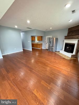 Empty room, Fireplace, Interior, Kitchen, Recessed Lighting, Wood Texture Flooring