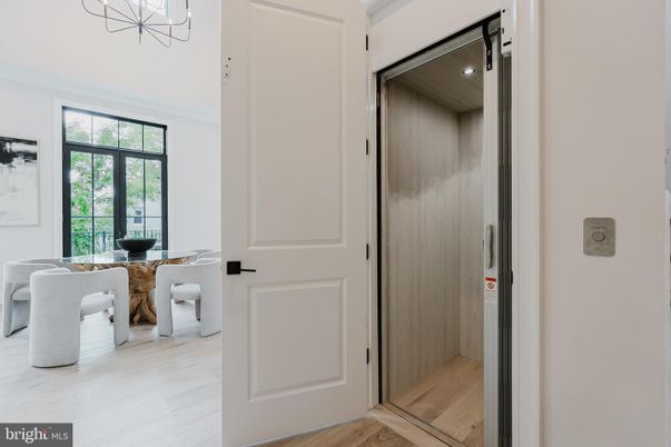 Dining room, Elevator, Interior, Recessed Lighting, Wood Texture Flooring, Wooden Walls