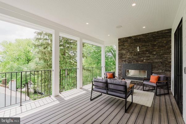 Fireplace, Interior, Living room, Recessed Lighting, Stone Walls, Wood Texture Flooring