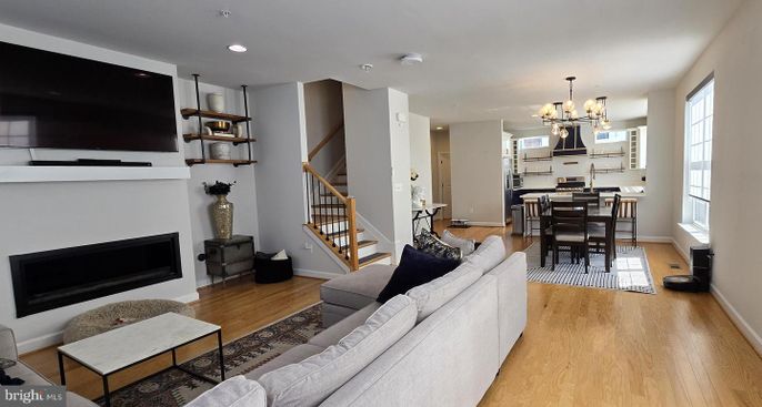 Chandelier, Dining room, Fireplace, Interior, Kitchen, Living room, Recessed Lighting, Wood Texture Flooring