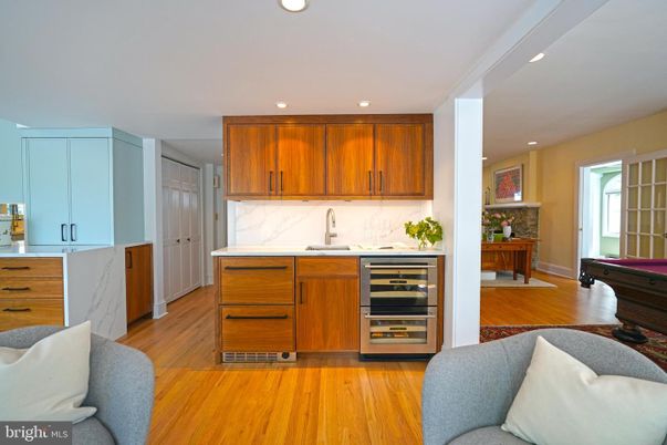 Interior, Kitchen, Marble Walls, Recessed Lighting, Stainless Steel Appliances, Wood Texture Flooring