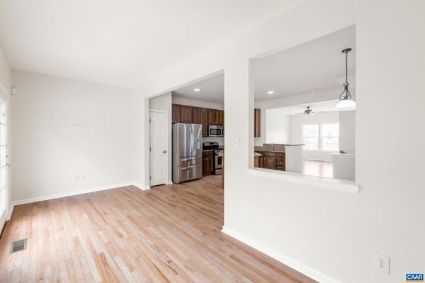 Empty room, Interior, Kitchen, Pendant Lights, Recessed Lighting, Stainless Steel Appliances, Wood Texture Flooring