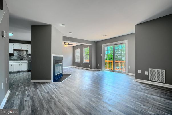 Empty room, Fireplace, Interior, Kitchen, Recessed Lighting, Wood Texture Flooring