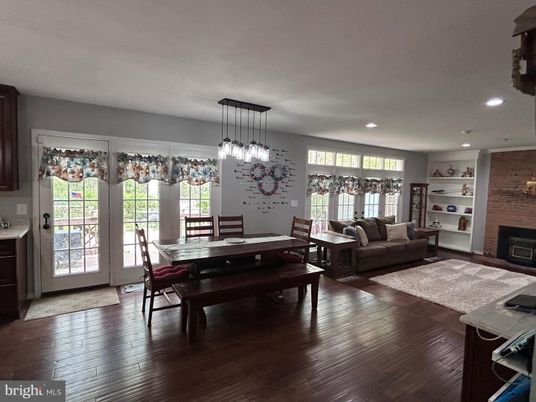 Dining room, Fireplace, Interior, Living room, Pendant Lights, Recessed Lighting, Wood Texture Flooring