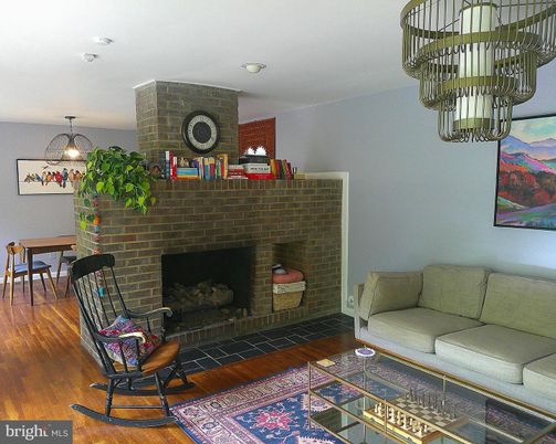 Dining room, Fireplace, Interior, Pendant Lights, Stone Walls, Wood Texture Flooring