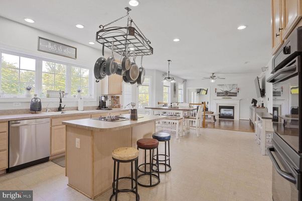 Dining room, Fireplace, Interior, Kitchen, Pendant Lights, Recessed Lighting, Stainless Steel Appliances