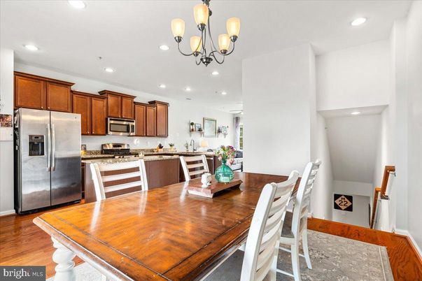 Chandelier, Dining room, Interior, Kitchen, Recessed Lighting, Stainless Steel Appliances, Wood Texture Flooring