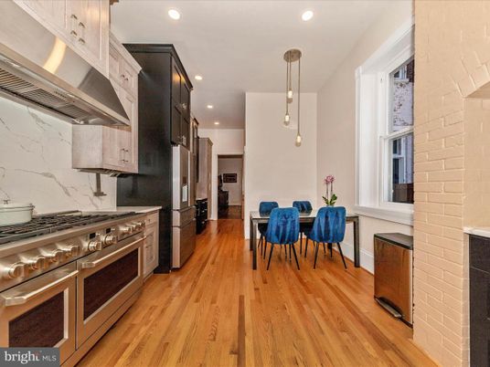 Dining room, Interior, Kitchen, Pendant Lights, Recessed Lighting, Stainless Steel Appliances, Stone Walls, Wood Texture Flooring